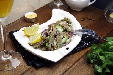 Salad with boiled beef, fresh cucumber and sesame seeds