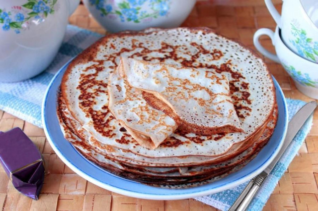 Custard pancakes on kefir and soda with holes