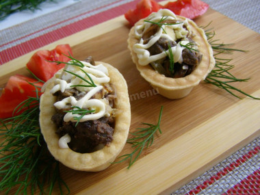 Belarusian salad with liver and mushrooms in tartlets