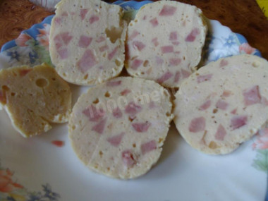 Boiled sausage with cream and ham