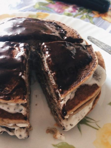 Pancake cake with bananas, chocolate and oatmeal