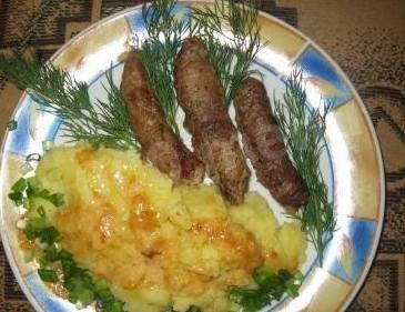 Pork chop rolls with bacon and garlic in the oven