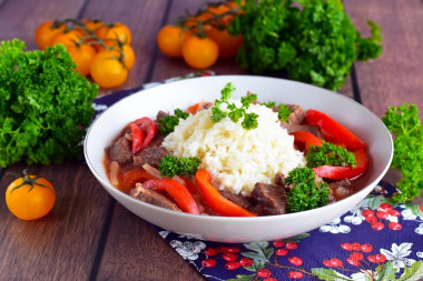 Rice with meat gravy in a frying pan