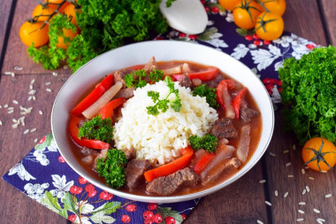 Rice with meat gravy in a frying pan