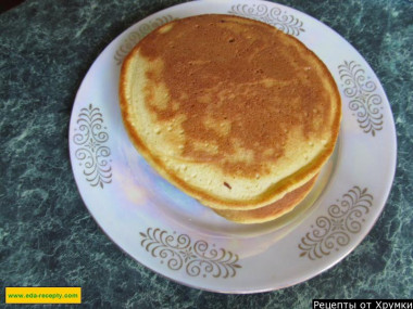 Yeast thick pancakes with butter on kefir