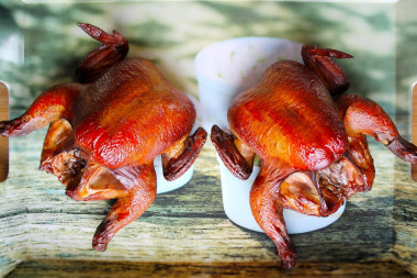 Hot smoked chicken in a smokehouse at home