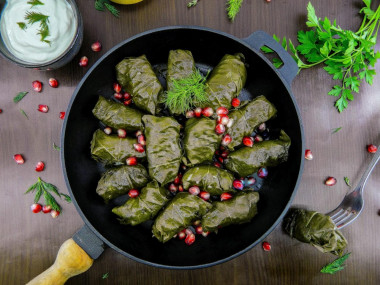 Classic dolma in grape leaves in a saucepan