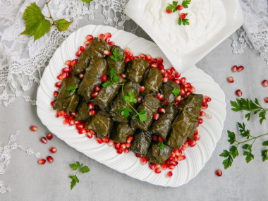 Classic dolma in grape leaves in a saucepan