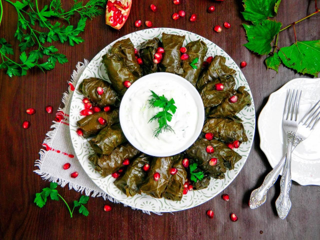 Classic dolma in grape leaves in a saucepan