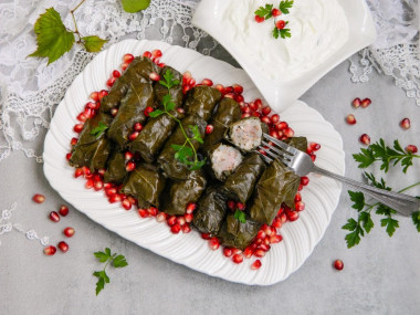 Classic dolma in grape leaves in a saucepan