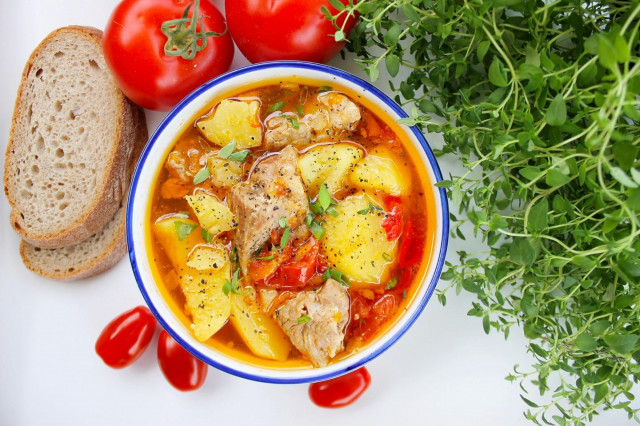 Stewed potatoes with pork in a saucepan