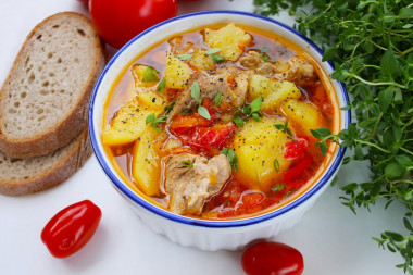 Stewed potatoes with pork in a saucepan