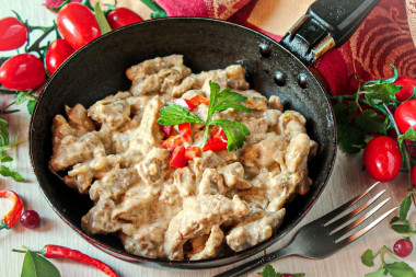 Stewed meat in sour cream - in sour cream sauce