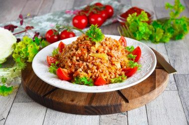 Buckwheat with cabbage stewed in a pan