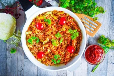 Buckwheat with cabbage stewed in a pan