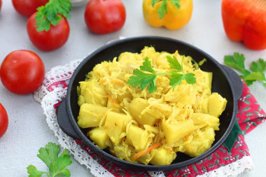 Potatoes with sauerkraut stewed in a frying pan