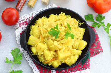 Potatoes with sauerkraut stewed in a frying pan