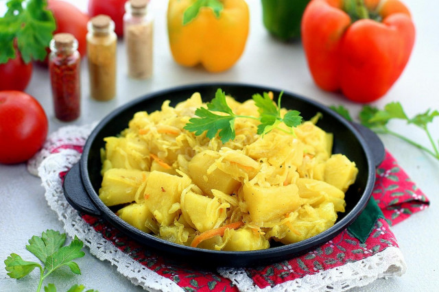 Potatoes with sauerkraut stewed in a frying pan