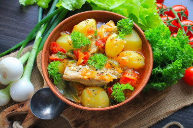 Stewed potatoes with pork ribs in a saucepan