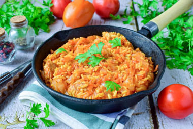 Cabbage with rice and meat stewed in a frying pan