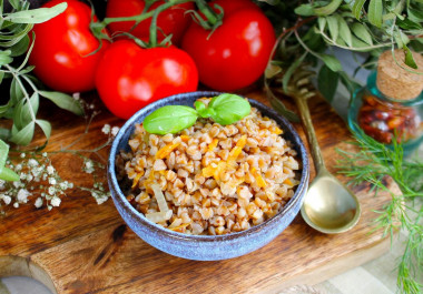 Buckwheat with onions and carrots in a pan