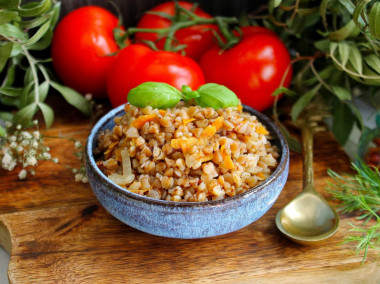 Buckwheat with onions and carrots in a pan