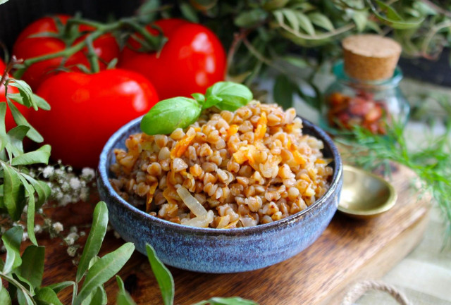 Buckwheat with onions and carrots in a pan