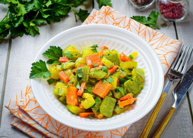 Stewed zucchini with carrots and onions