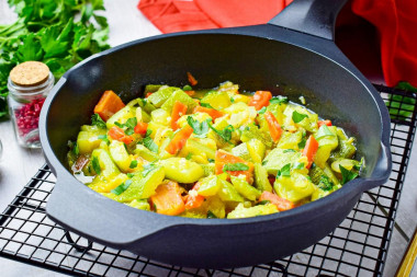 Stewed zucchini with carrots and onions