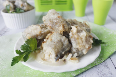 Pollock stewed in milk in a frying pan