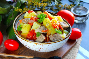 Stewed potatoes with tomatoes and meat