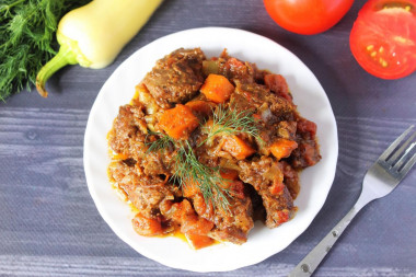 Beef stewed with vegetables in a slow cooker