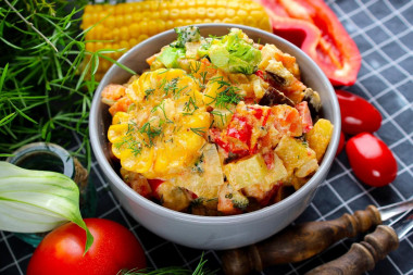 Stewed vegetables in sour cream in a frying pan