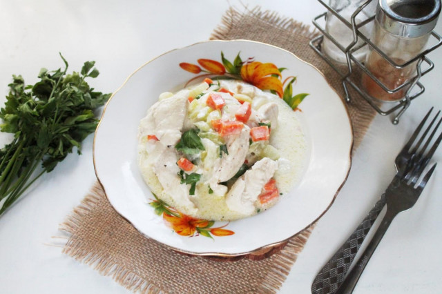 Chicken fillet with carrots and celery, stewed in sour cream