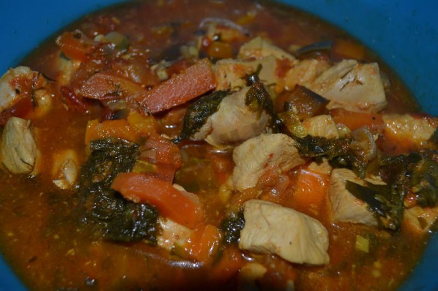 Stewed chicken fillet with vegetables in a slow cooker