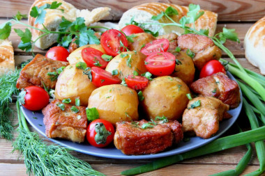 Potatoes with meat in a cauldron