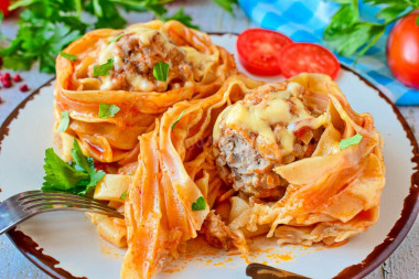 Pasta nests with minced meat in a frying pan