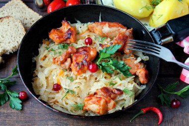 Chicken with sauerkraut in a frying pan