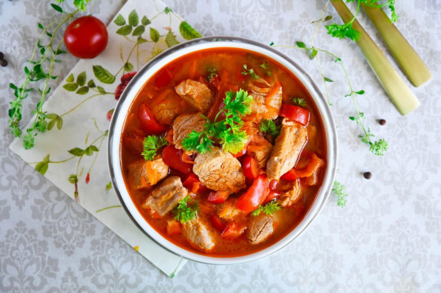 Pork goulash with gravy in a slow cooker