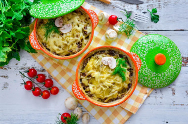 Potatoes in pots with mushrooms and cheese