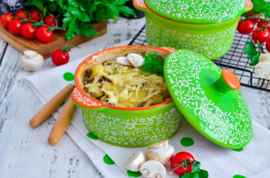 Potatoes in pots with mushrooms and cheese