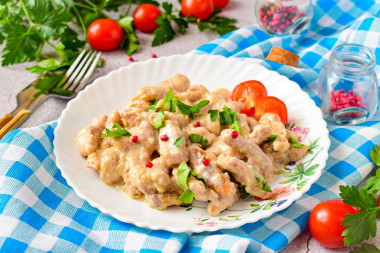 Pork beef stroganoff with gravy in a frying pan