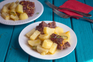 Smoked ribs with potatoes in a slow cooker