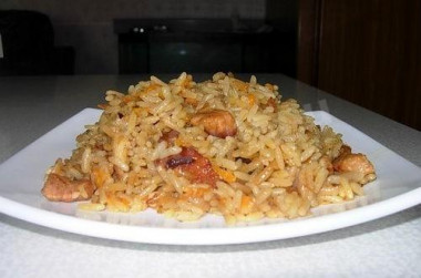 Pilaf in the oven with crumbly pork