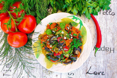 Saute zucchini and eggplant with vegetables in a frying pan