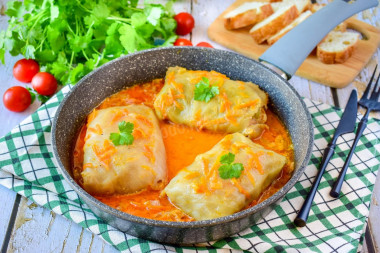 Frozen cabbage rolls in a frying pan