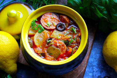 Solyanka in pots in the oven with cabbage