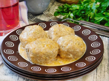 Meatballs in tomato sour cream sauce in the oven