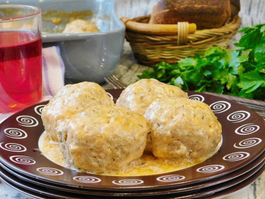 Meatballs in tomato sour cream sauce in the oven