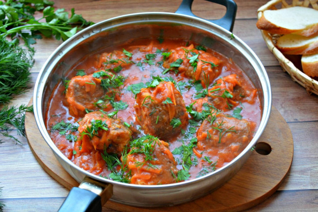 Fish with gravy on frying pan